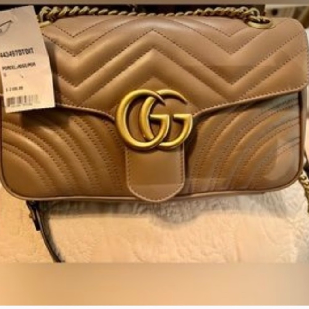 Tan Gucci bag still has tags on it never used
